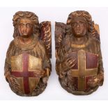 A pair of Victorian carved wood and polychrome decorated corbels: in the form of angels,