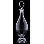 A Georgian glass decanter and stopper: of Indian Club shape cut with interlocking bands of stylised