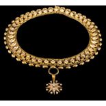 An Etruscan-style seed pearl mounted collar necklace: each pierced panel with a single seed pearl,