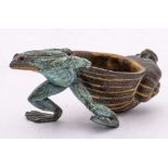 An Austrian patinated and gilt bronze ashtray: in the form of a toad pulling a large upturned shell,