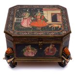 An Indian wood and polychrome decorated spice box: the square hinged lid decorated with figures in