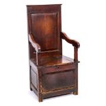 An 18th Century oak box seat armchair:, with a rectangular fielded panel back,