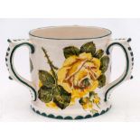 An Exon Ware Wemyss pottery tyg: decorate with green, yellow and white cabbage roses, painted Exon,