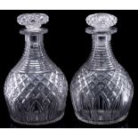 A pair of mid 19th century heavy cut glass decanters and mushroom stoppers: with horizontal cut