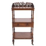 A Victorian rosewood rectangular three tier whatnot:,