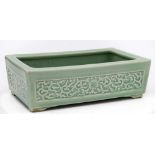 A Chinese celadon jardiniere: of squat rectangular form,