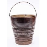 A 19th Century Dutch carved walnut bucket: of cylindrical tapering form,