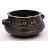 A Chinese bronze censer: of circular squat form,
