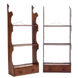 Two similar George III mahogany three tier hanging bookcases:, having shaped uprights,