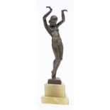 Stefan Dakon An Art-Deco bronze figure: depicting a nude female on tip-toes with her hands raised