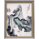 A Chinese porcelain rectangular plaque: painted with a sailing boat in a mountainous river