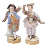 A pair of Meissen figures of a youth and companion holding garlands: wearing eighteenth century