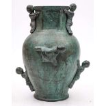 A 20th Century Chinese bronze 'Boy' vase: of ovoid outline, with a hexagonal neck and rim,