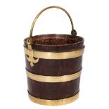 A 19th Century oak and brass bound bucket:, with brass loop carrying handle, 30cm (1ft) diameter,
