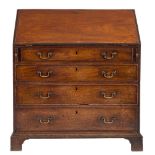 A George III mahogany bureau:,