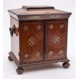 A Victorian rosewood and mother-of-pearl inlaid table top vanity cabinet: with shallow domed hinged