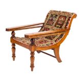 A 19th Century mahogany plantation armchair:, with later carpet upholstery,
