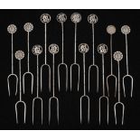 A set of fourteen Chinese silver olive forks : of traditional design with simulated bamboo shafts,