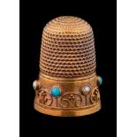 A 15ct gold, turquoise and seed pearl set thimble: with applied wirework frieze decoration, cased.