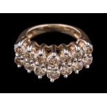 A diamond mounted tiered two-row half-hoop ring: with circular brilliant-cut diamonds estimated to