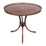 A 19th Century Russian mahogany and brass inlaid circular centre table:, bordered with brass lines,