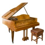 Bluthner, Leipzig, A baby grand piano in a walnut case, No 122031: on square tapered legs,