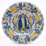 A Dutch Royal portrait delft dish: of lobed form, painted in blue,