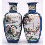 A pair of Chinese famille rose/verte vases: of ovoid form with waisted necks and flared rims,