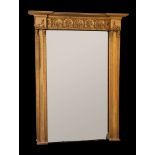 A fine Regency giltwood and gesso overmantel mirror:, of large size in the Egyptianesque manner,
