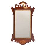 A late 19th Century mahogany, inlaid and partly gilt fret cut mirror:,
