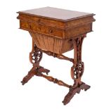 A Victorian walnut combined writing and work table:, the burr figured hinged moulded top,