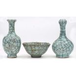 Two Chinese Guan-type vases and a similar bowl: covered with pale blue crackled glazes,