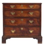 A George III mahogany rectangular chest:, the top with a moulded edge,