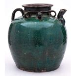A Chinese green crackle-glazed earthenware globular jar: with short spout and loop handle, 27cm.