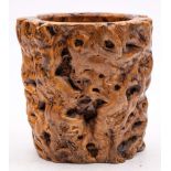 A Chinese rootwood brushpot: of cylindrical naturalistic design, 21cm. diameter, 23cm. high.