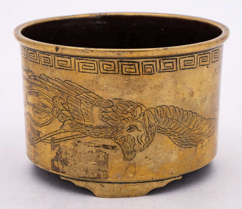 A Japanese brass koro: of circular outline with incised decoration of a Ho-Ho bird and cartouche