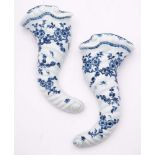 A pair of First Period Worcester blue and white cornucopiae wall pockets: of spiral moulded form,