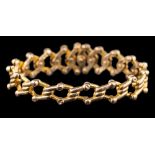 A 15ct gold bracelet of expanding concertina linking: stamped 'Baden' and '15',