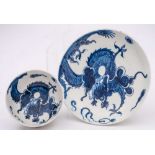 A Lowestoft blue and white teabowl and saucer: painted with the 'Dragon' pattern of a coiled dragon