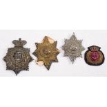 Two Worcestershire Regiment pouch badges, a helmet plate and a Royal Navy cloth cap badge (4):.
