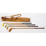 A set of child's golf clubs by Pyramid for Hamleys, London: comprising a brass head putter,