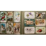 Three Edwardian part-filled postcard albums: containing greetings cards,