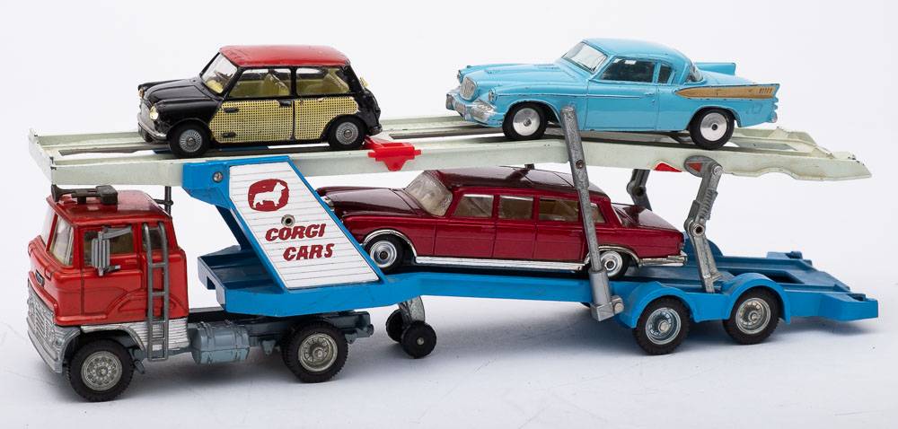 An unboxed group of four Corgi vehicles: 211 Studebaker Golden Hawk, 249 Morris Mini -Cooper,