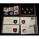 A cased set of six Queen Elizabeth II medallions: with two silver medal stamp covers and a set of