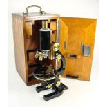 An Ernst Leitz Wetzlar brass and lacquer microscope:, No 209079, signed as per title,