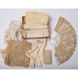A small collection of lace and kid gloves,