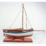 A scale model of a Falmouth work boat: standing rigged,