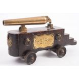 A 19th century brass desk cannon:, the six inch brass barrel with screw adjust cascabel,