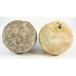 An 18th century granite cannonball together with a similar sandstone cannonball:(2)