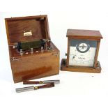 A mahogany cased 'The Berners' battery electro convulsive therapy set together with a Nivoc